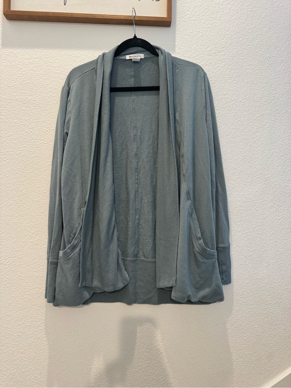Athleta Pranayama Wrap in a muted green w/ open draped front